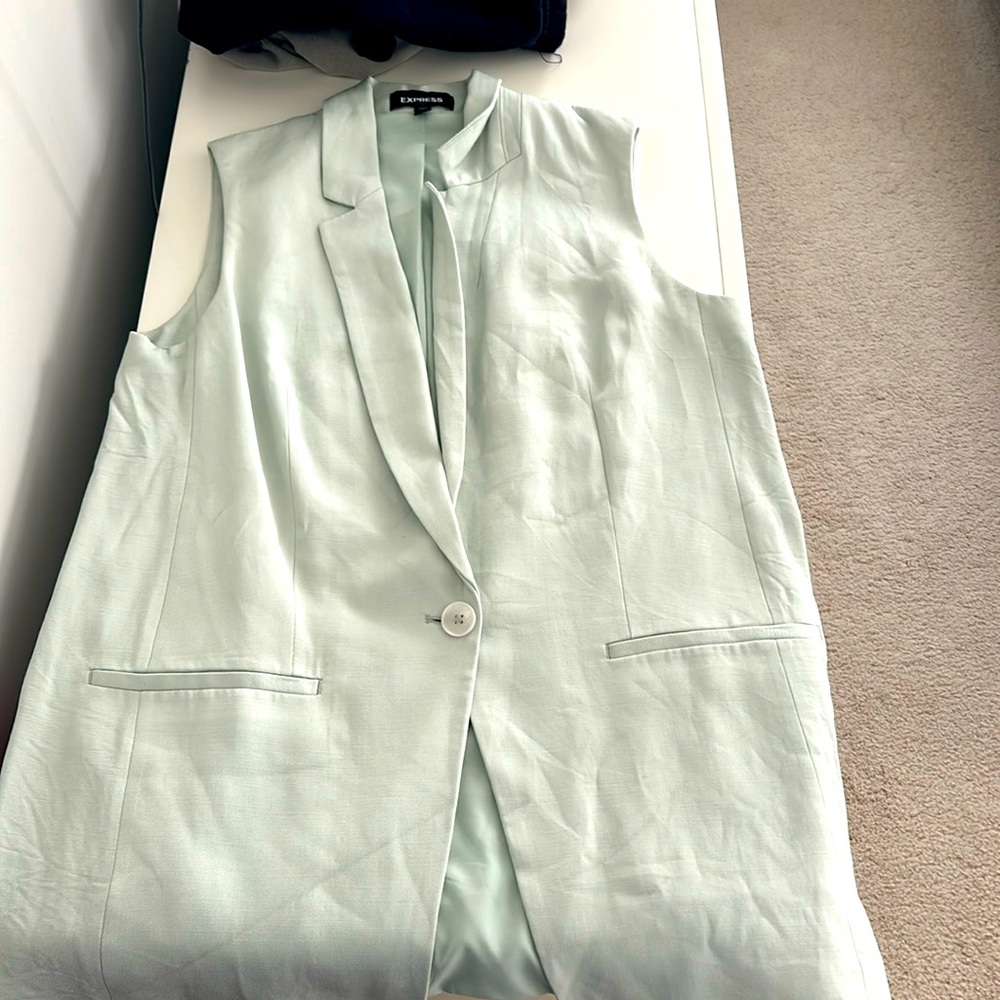 Sleeveless blazer size medium.